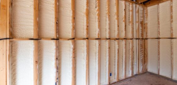 A wall in a new home build with spray foam insulation mid-construction.