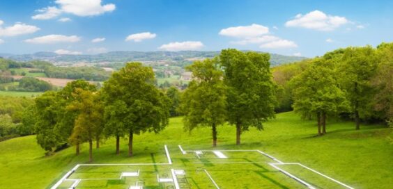 An open plot of land with a few trees near the back. There is a floating outline of a house that is to be built on the land.